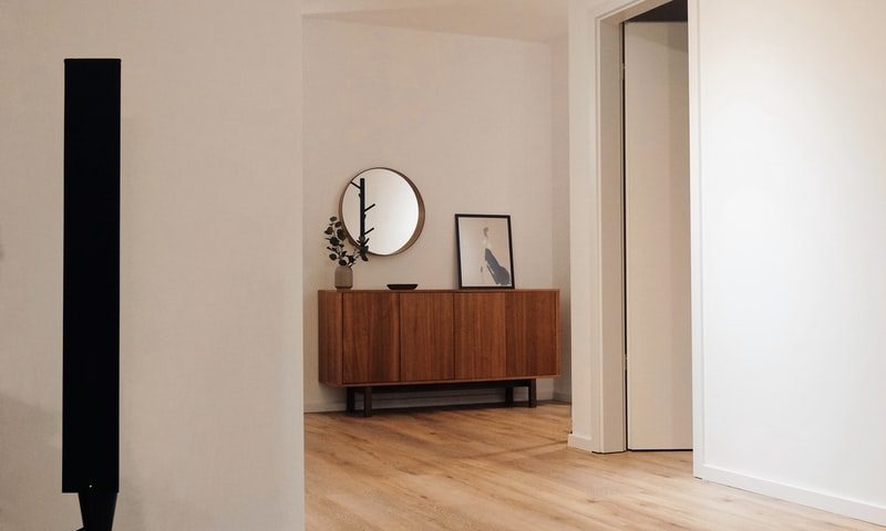black tower speaker beside white wall